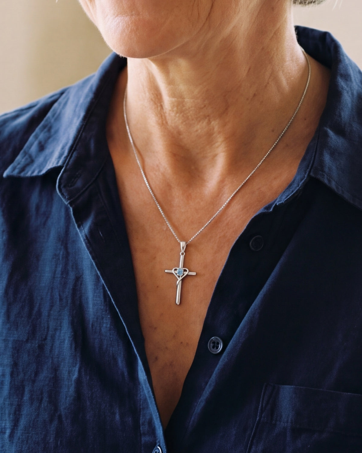 The blue Azure Heart Cross worn, second close-up, true to size [c:blue]