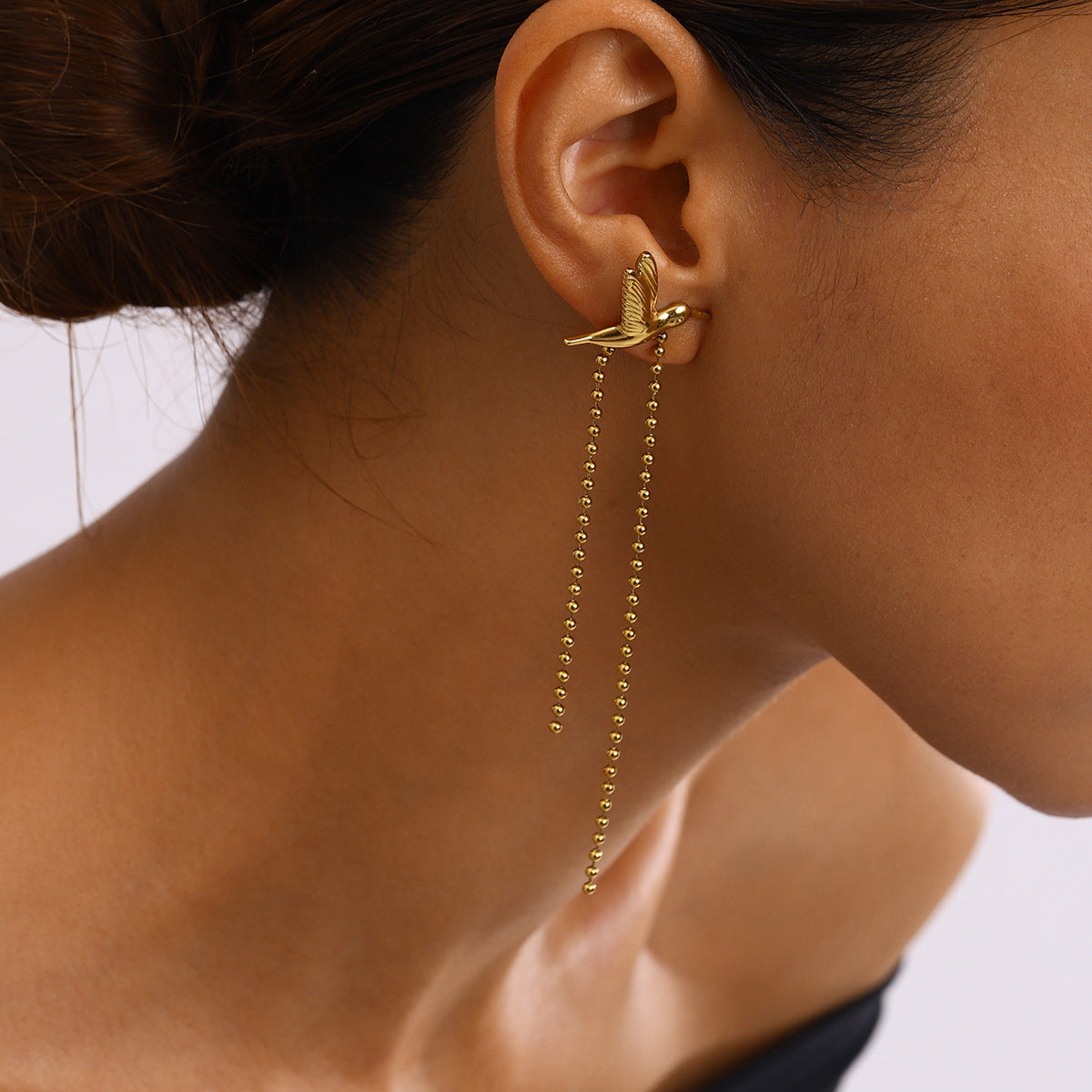 The Golden Flight Stainless Steel Gold Hummingbird Earrings view 2
