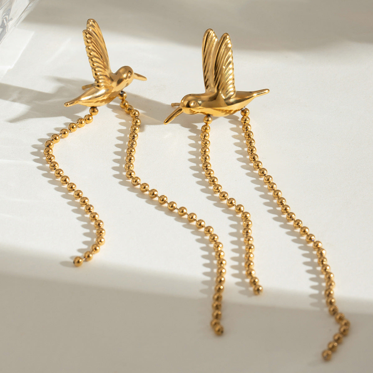 The Golden Flight Stainless Steel Gold Hummingbird Earrings view 4