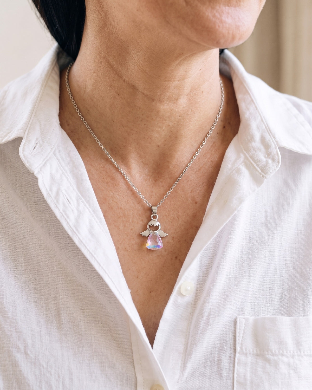 The Crystal Guardian worn by a woman, close-up from chin to chest, true to size