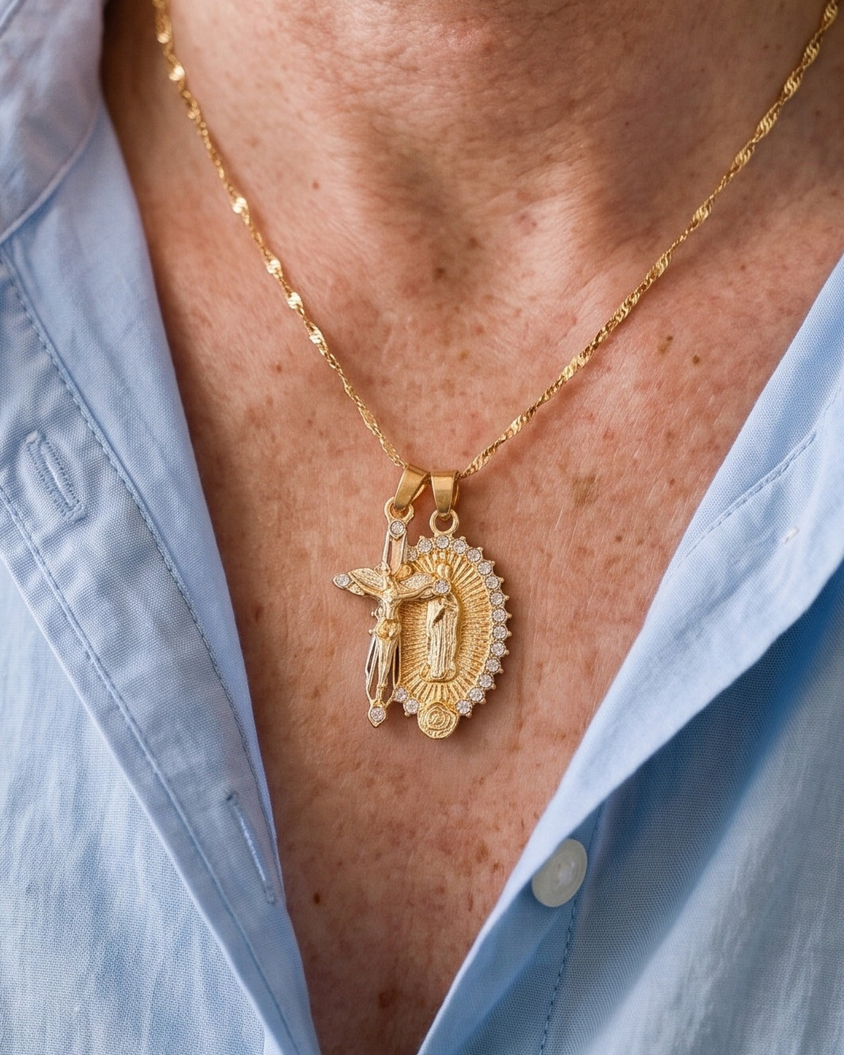The gold Guadalupe Crucifix worn by a woman, pendant close-up, true to size [c:gold]