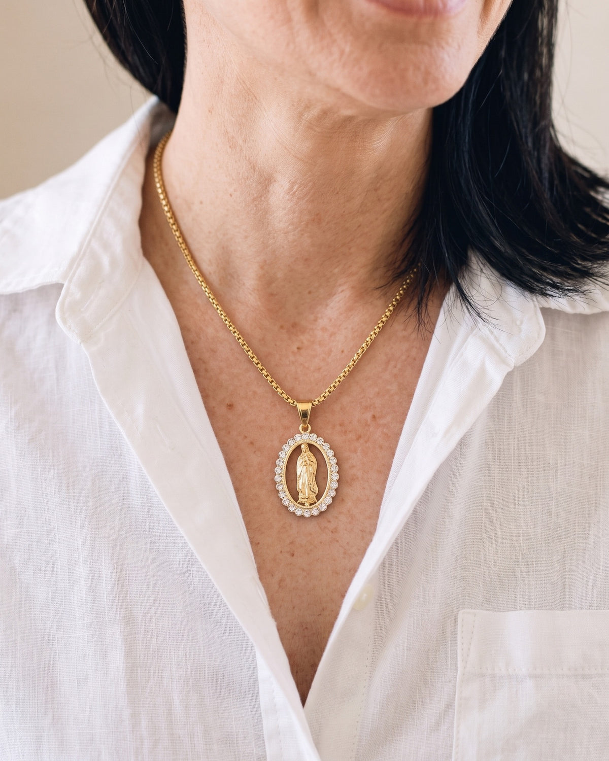The Marian Radiance worn on the chest, close-up, true to size [c:small-25-x-45-mm]