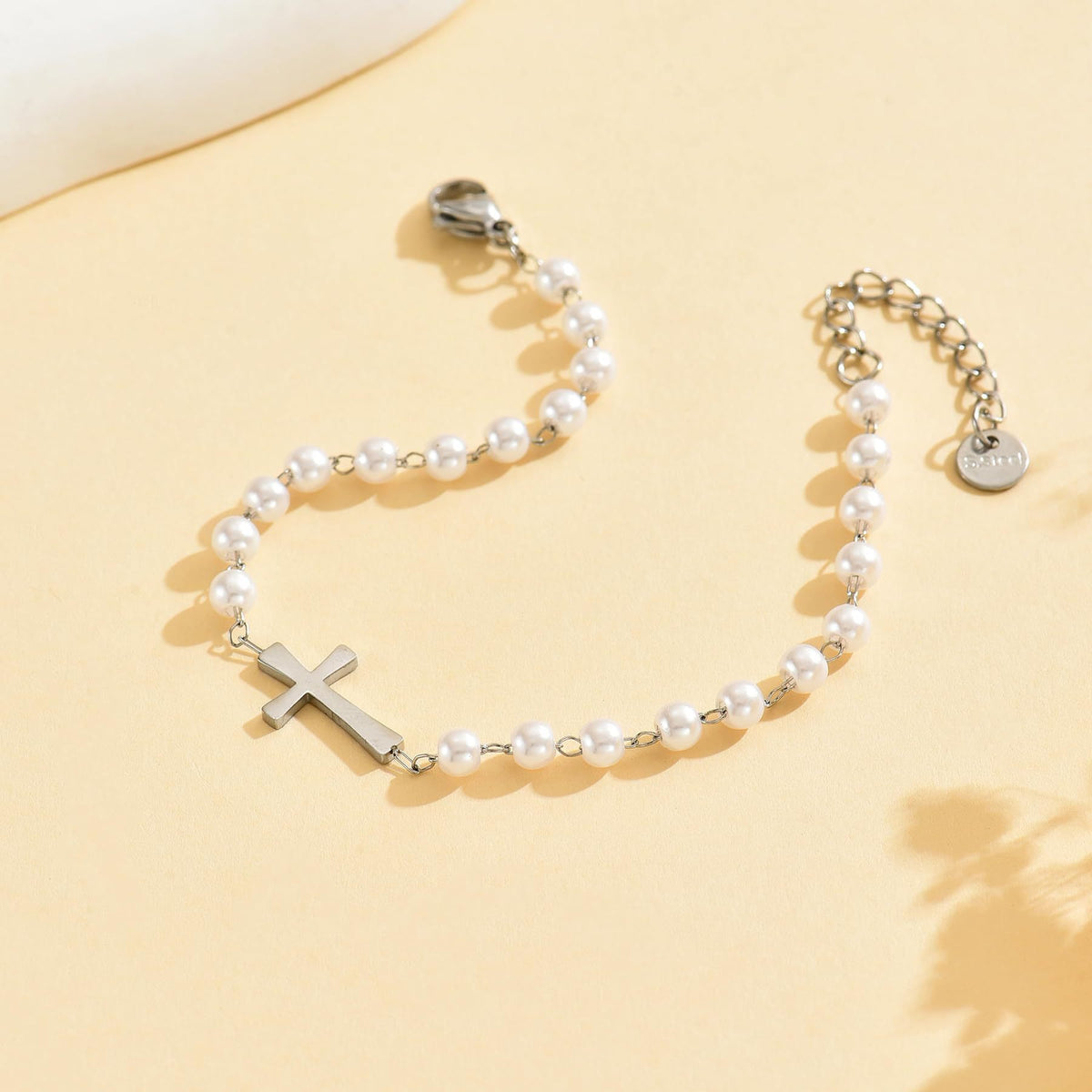 The Serene Strand imitation pearl cross bracelet