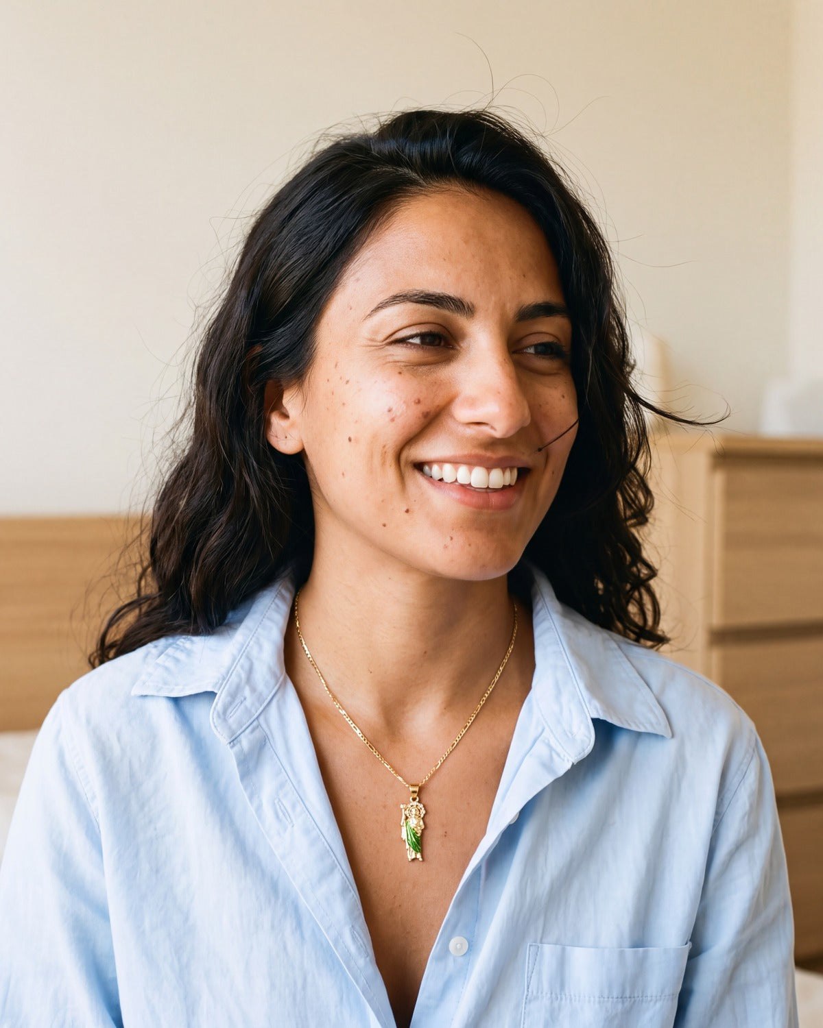 Smiling woman wearing The Saint Jude Necklace, Medium size
