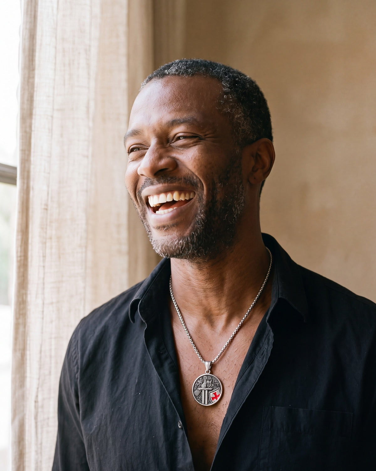 Smiling man wearing the silver Crusader's Vow