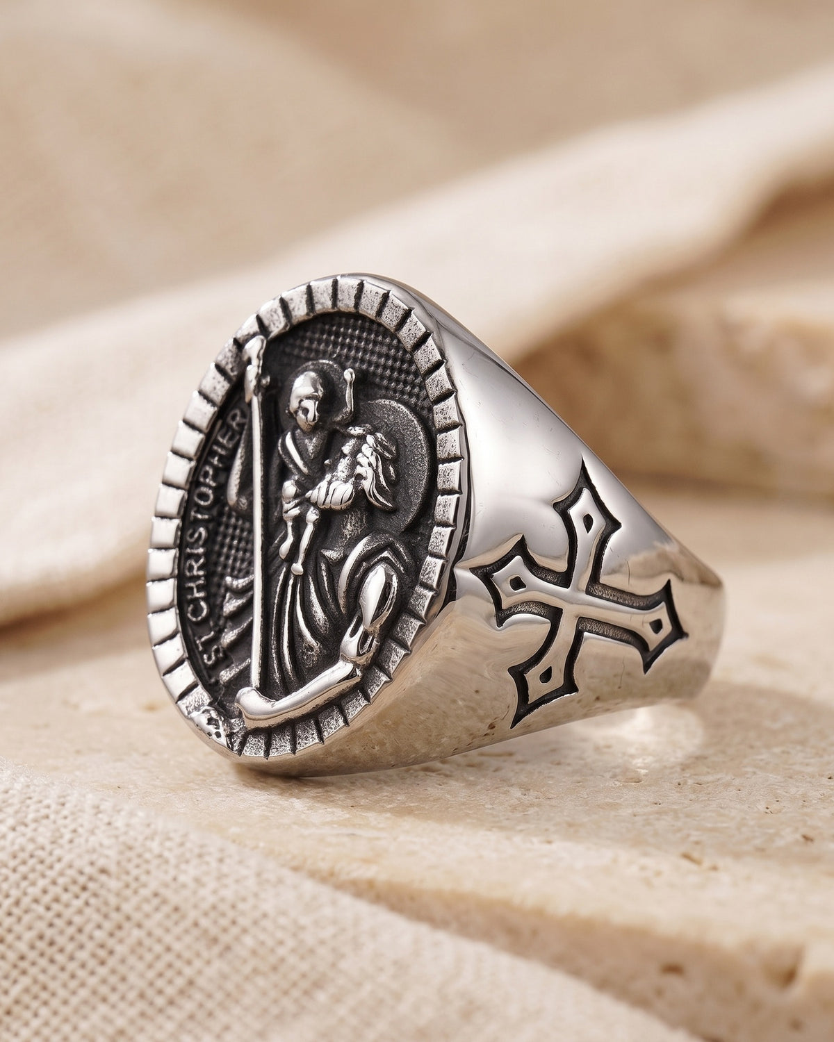 The silver Divine Carrier signet ring, side view with the cross on the band
