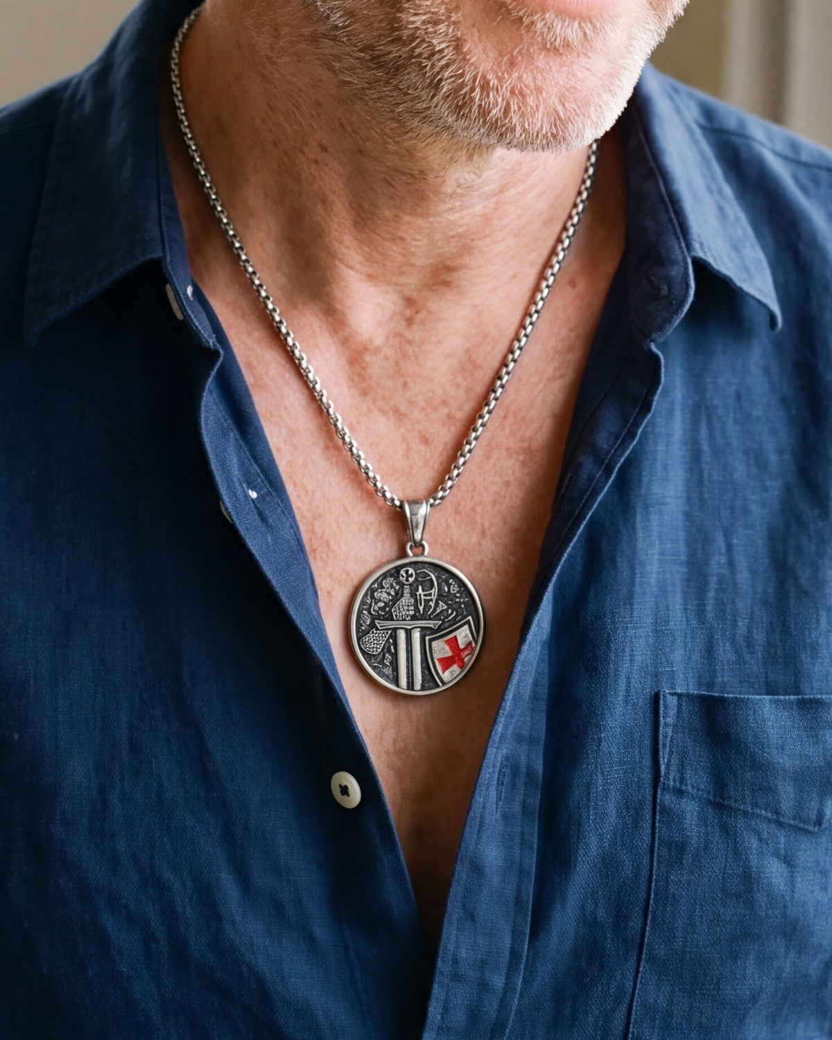 The silver Crusader's Vow worn by a man, close-up, true to size