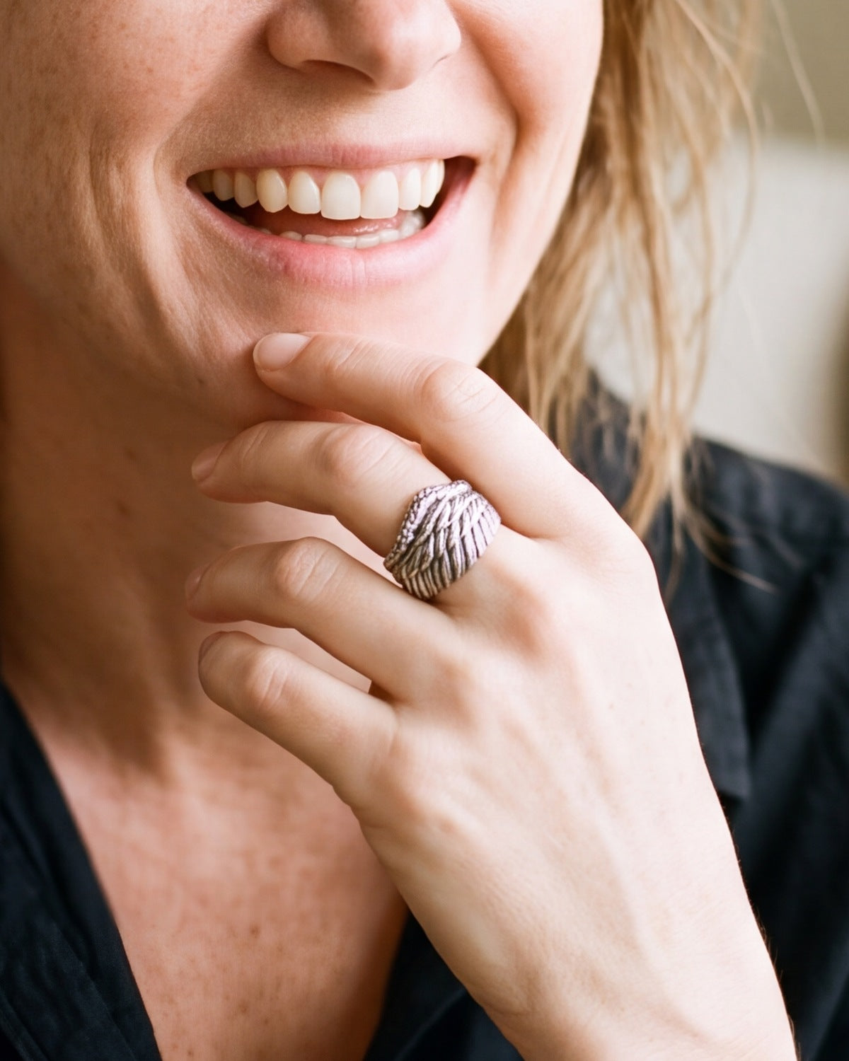 The silver Angelic Flight worn by a woman, close-up, true to size