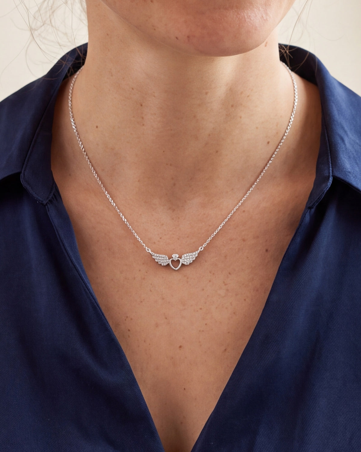 The Angelic Heart worn on the chest, close-up, true to size [c:silver]