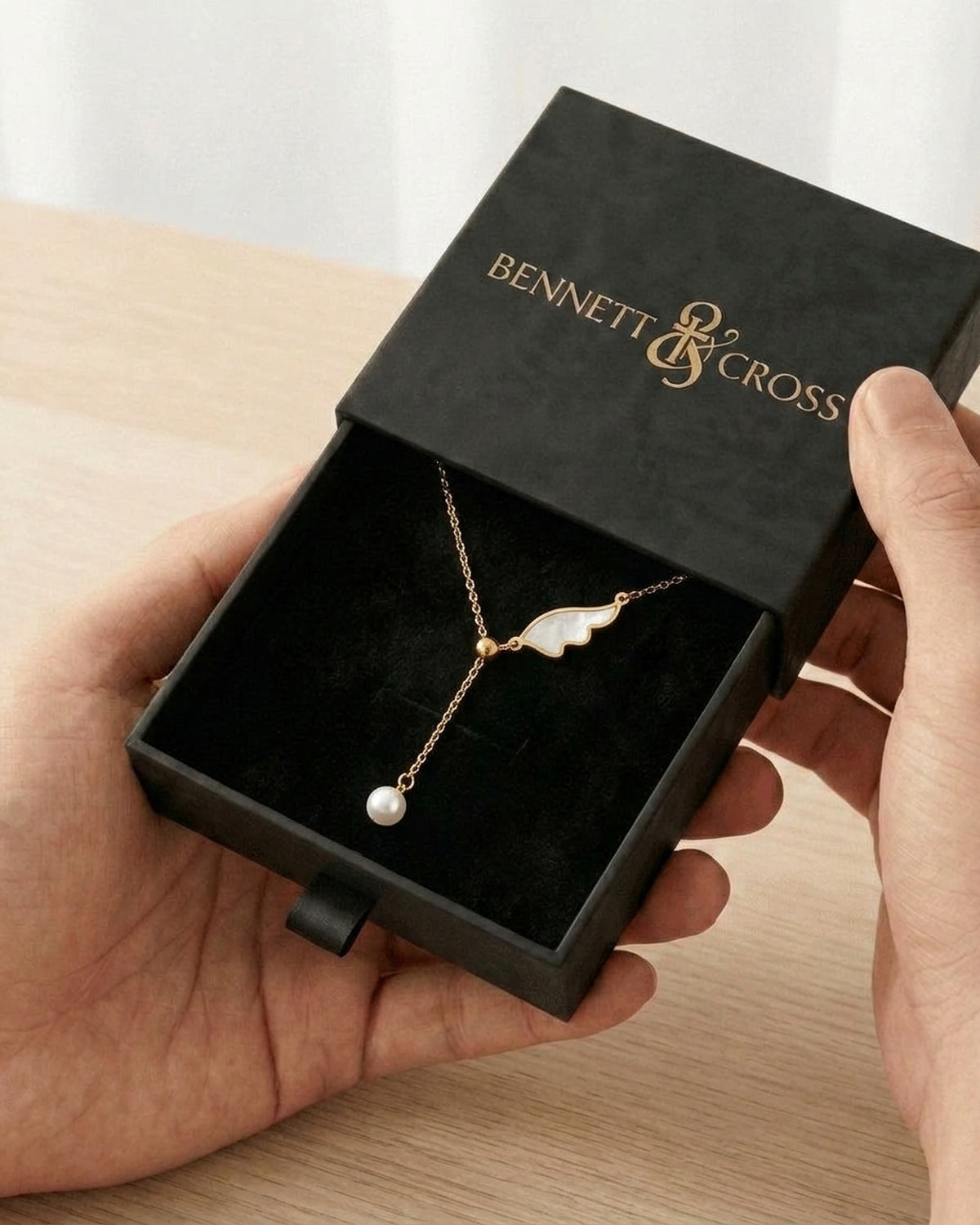 The Angelic Pearl in its black Bennett & Cross gift box