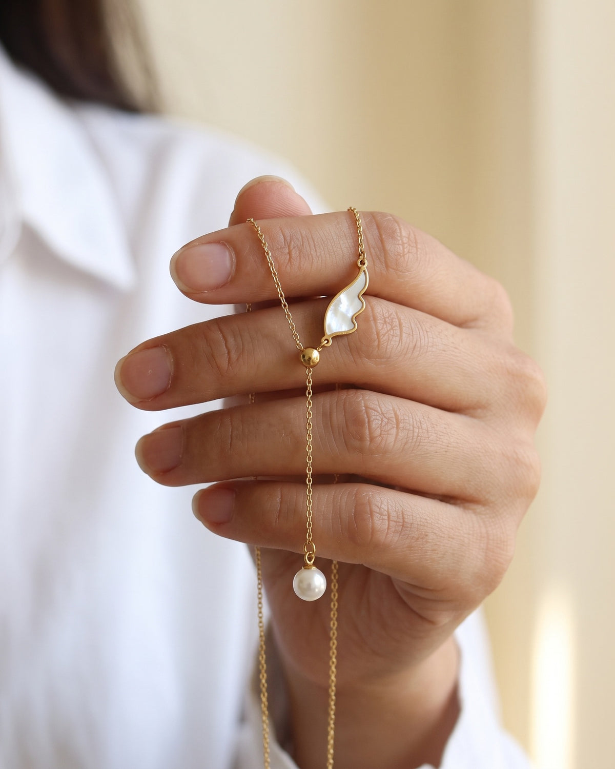 The Angelic Pearl held in the hand, true to size