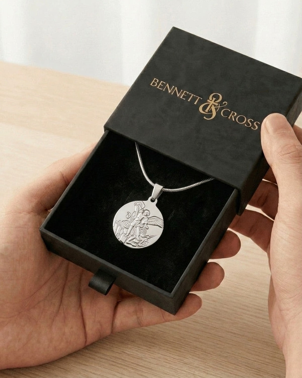 The Angelic Protector in its black Bennett & Cross gift box