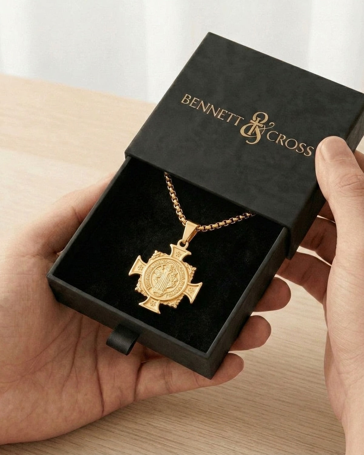 The Benedict Cross Medallion in its black Bennett & Cross gift box