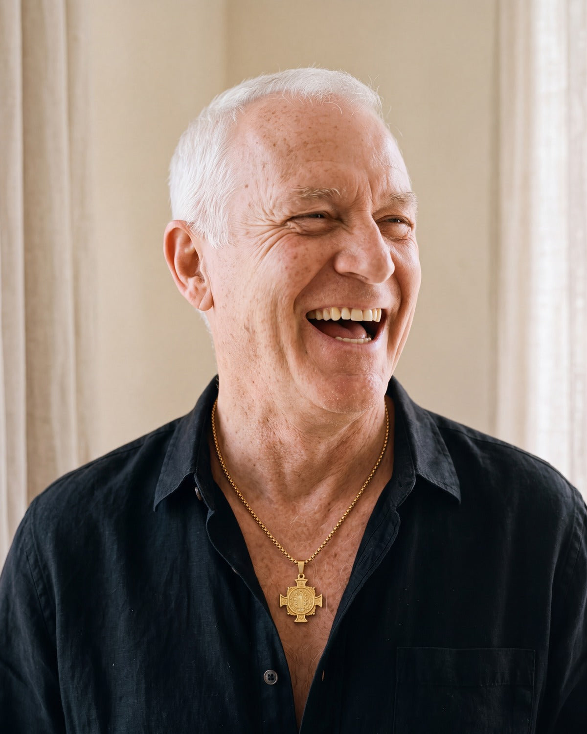 Smiling man wearing the gold Benedict Cross Medallion [c:gold]