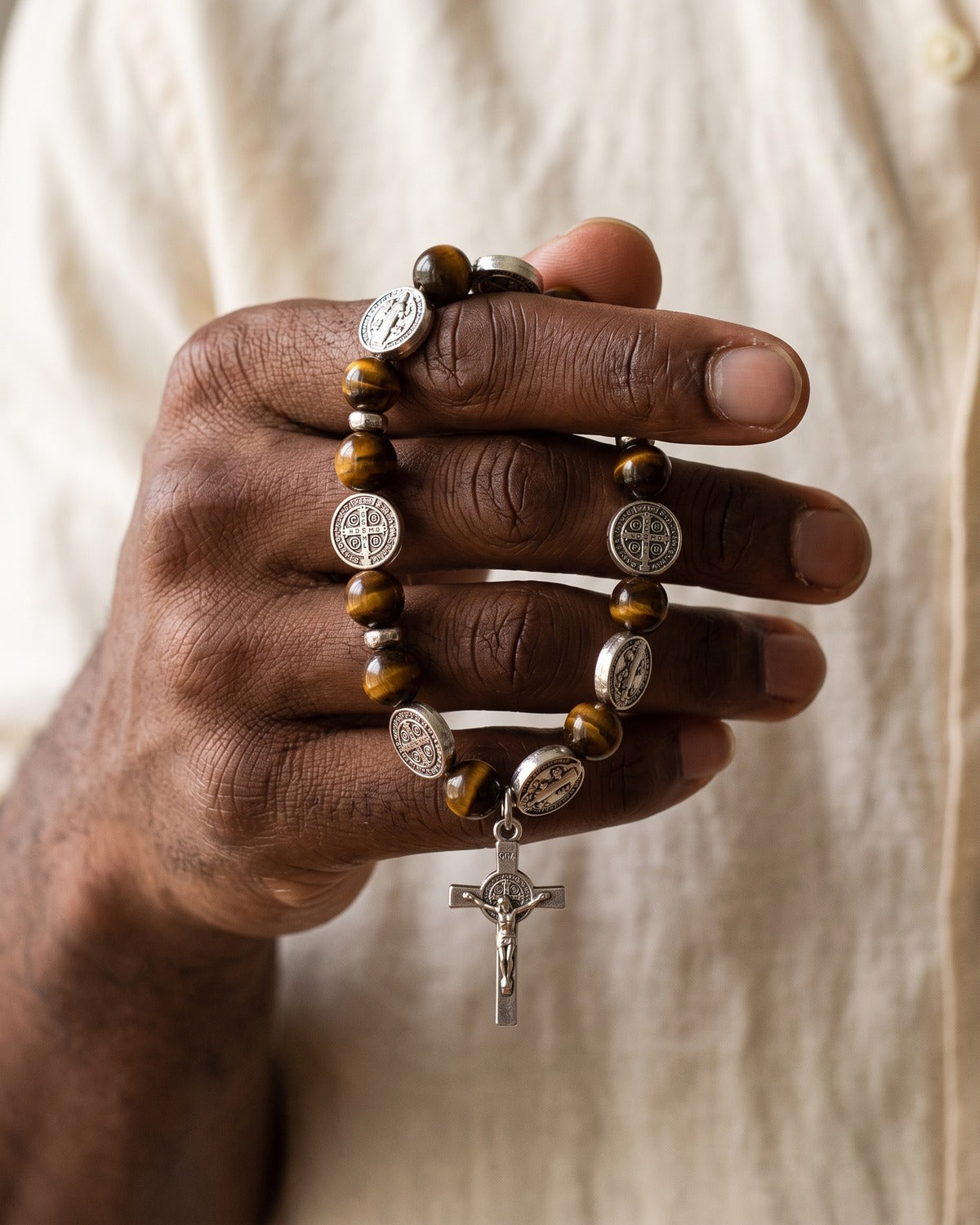 The Benedict Tiger's Eye bracelet held in the hand, true to size