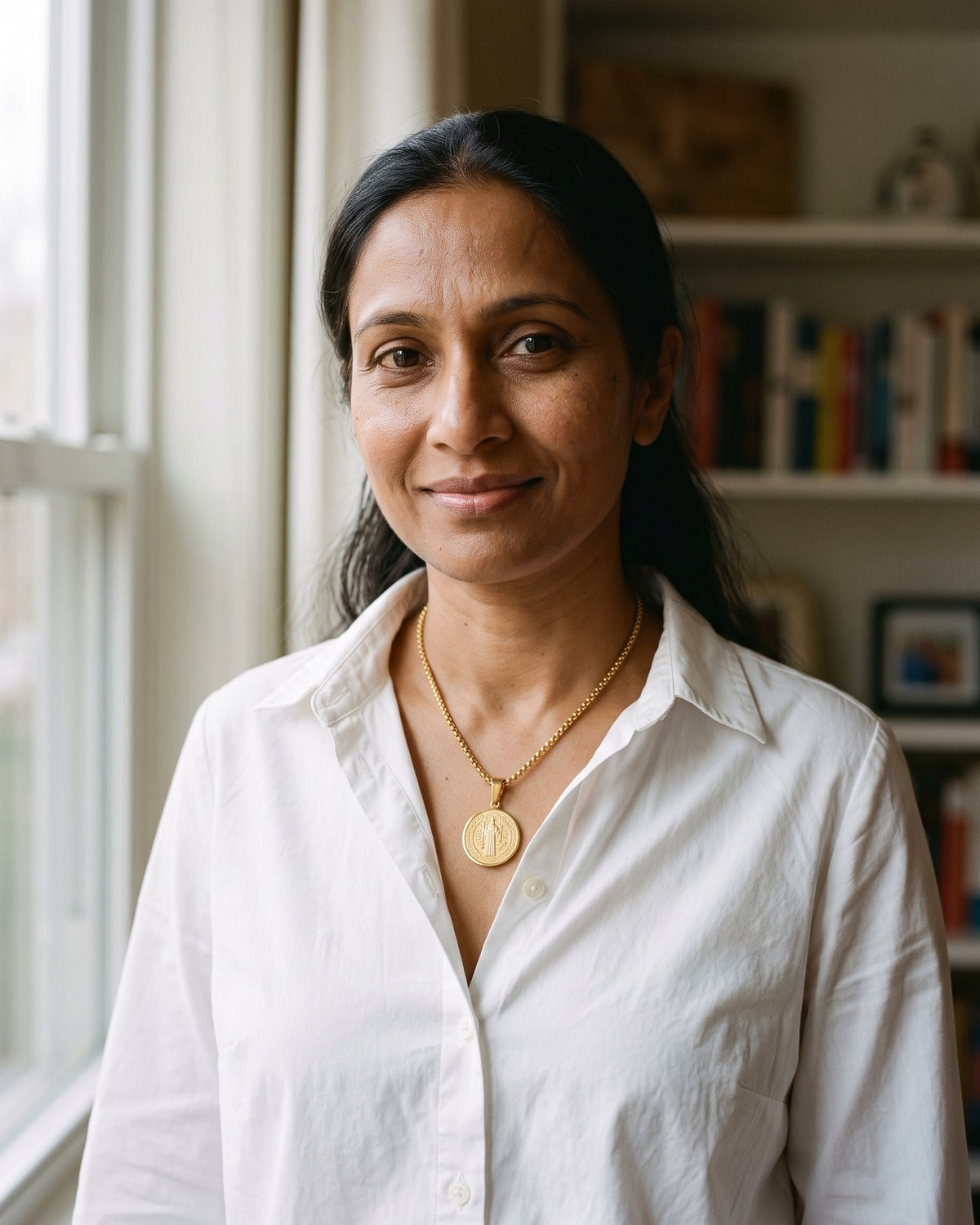 Woman wearing the gold Benedictine Medal