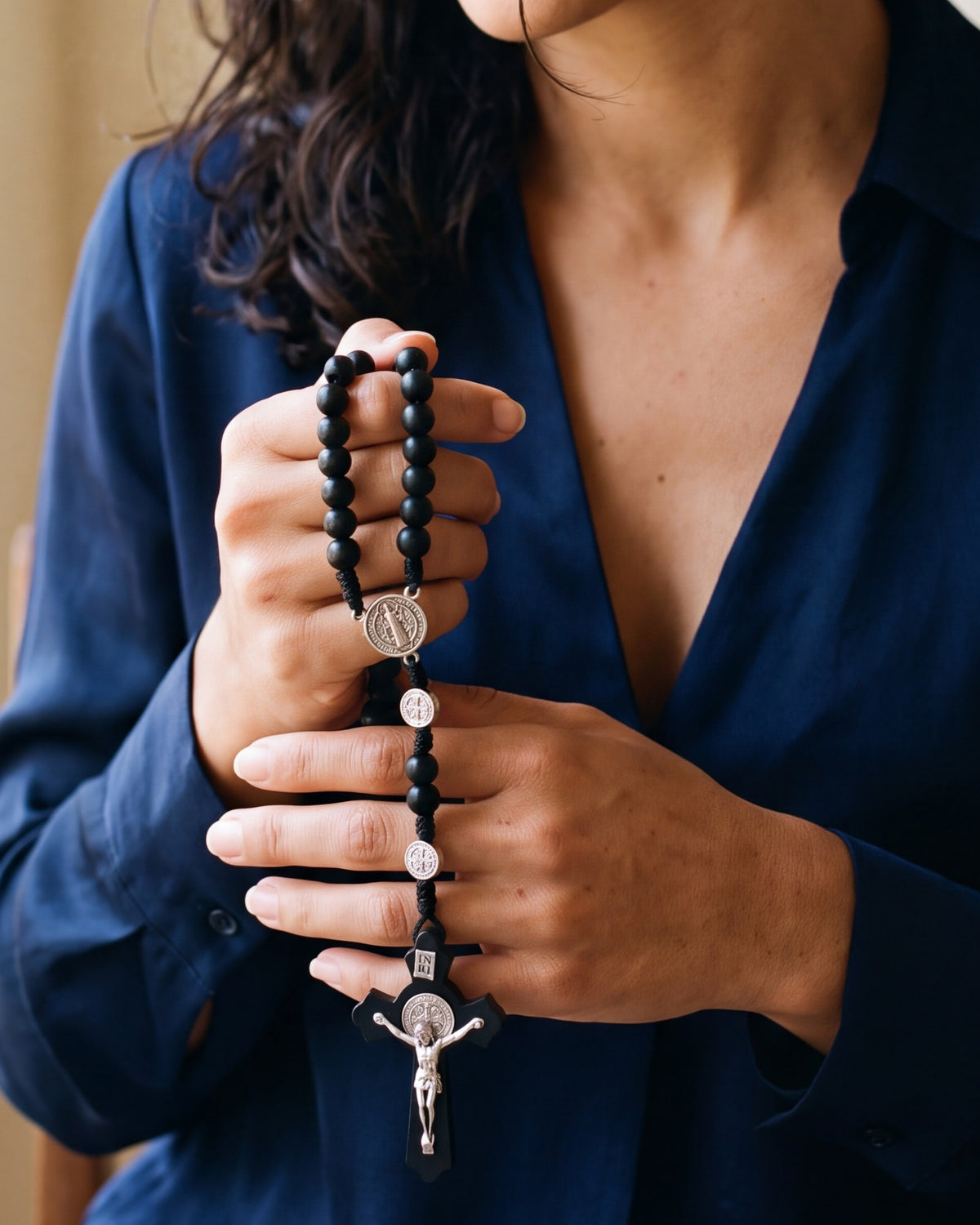The Benedictine Path held in a woman's hands, close-up