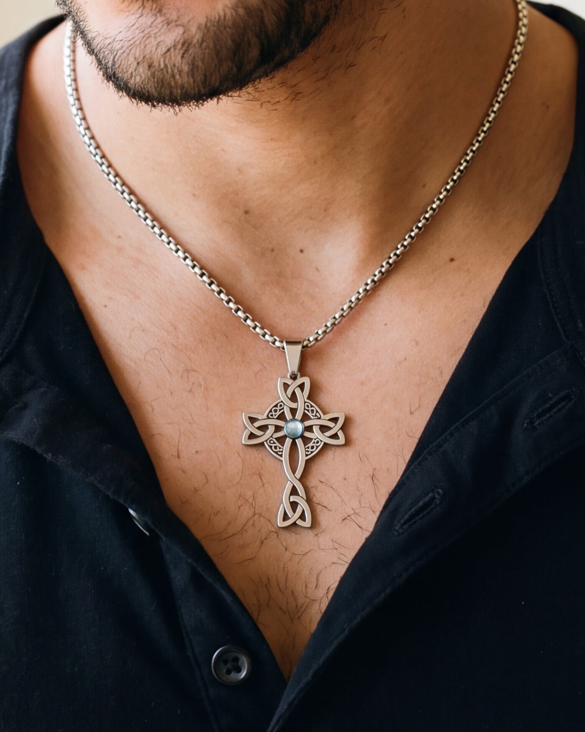 The Celtic Knot Cross worn by a man, close-up, true to size [c:silver]