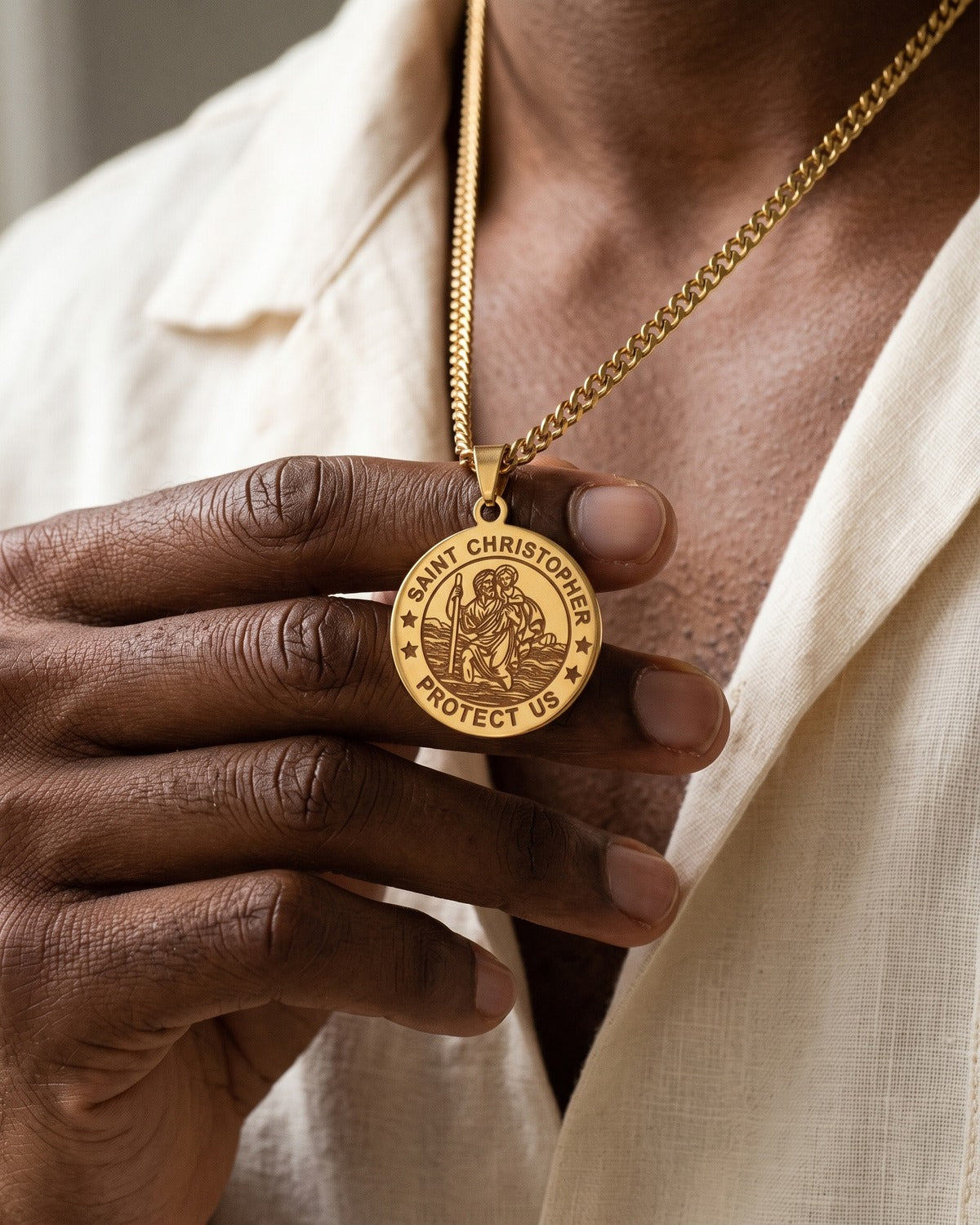 The Christopher Coin medal held in the hand, Saint Christopher Protect Us engraving, true to size [c:gold]