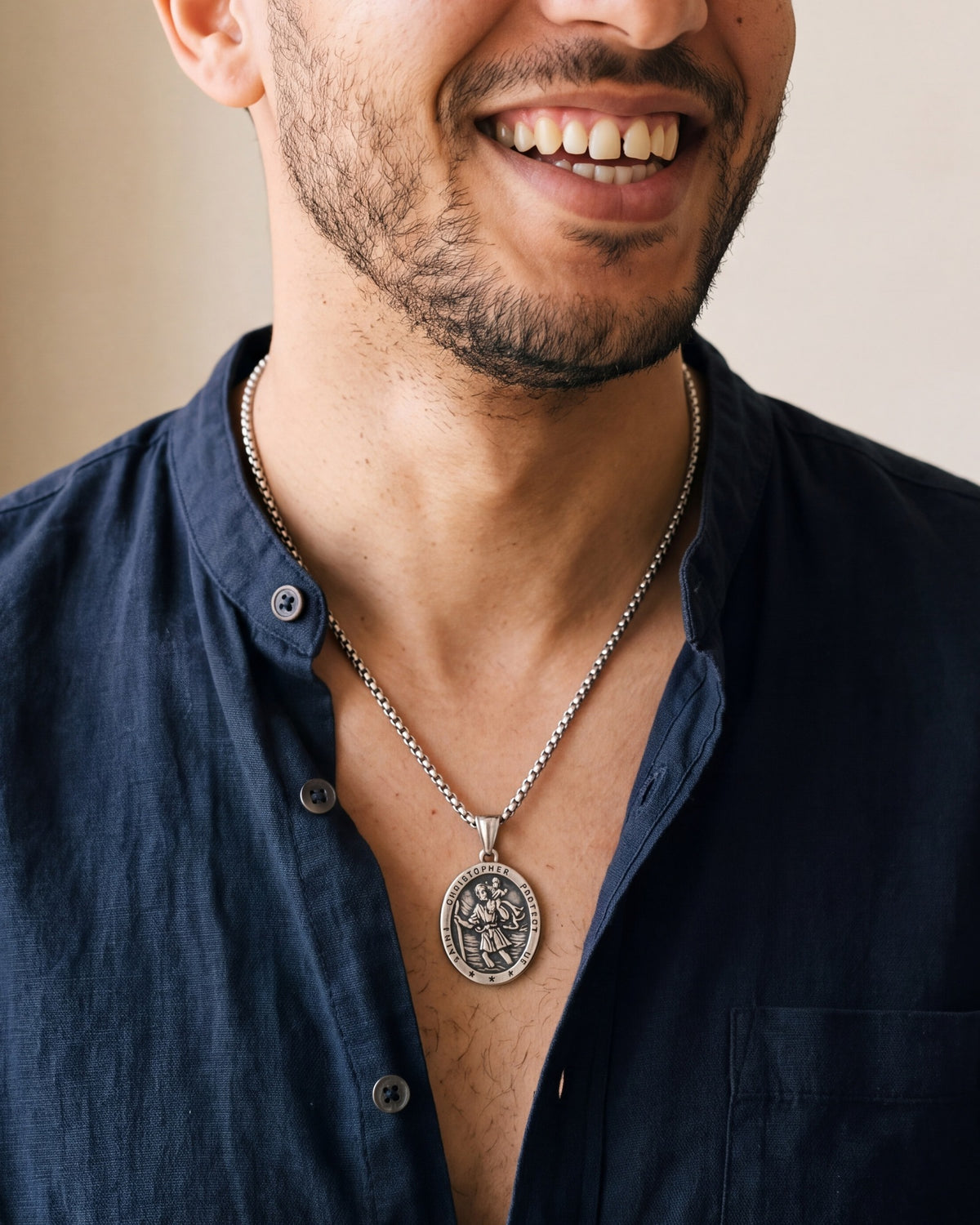 The Christopher Crossing worn on the chest, close-up, true to size