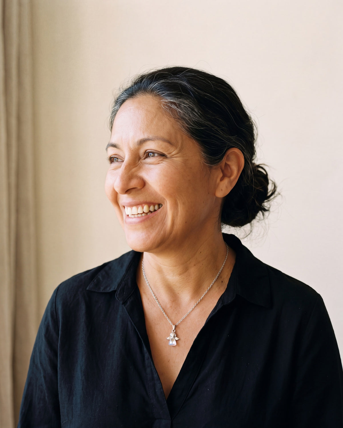 Smiling woman wearing The Crystal Guardian