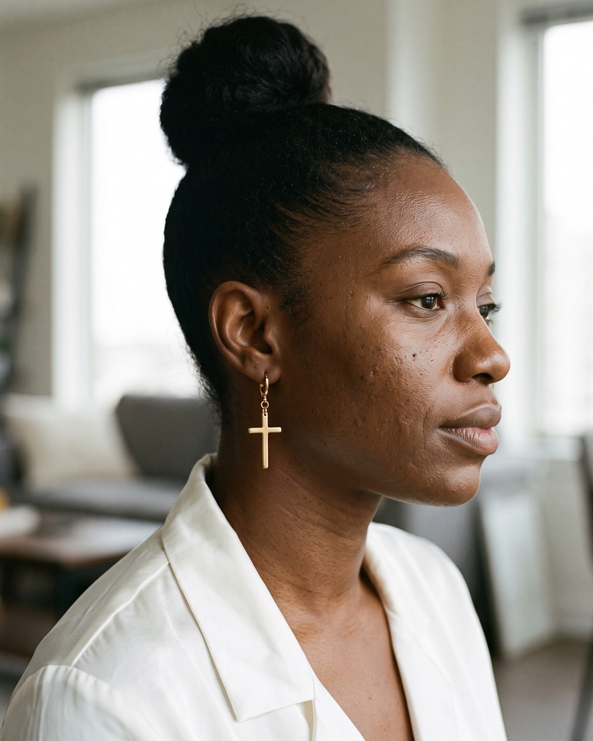 Woman wearing the gold Dark Cross
