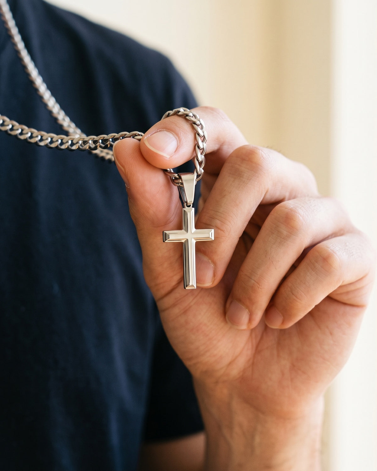 The Devotion Cross held in the hand, true to size [c:silver]
