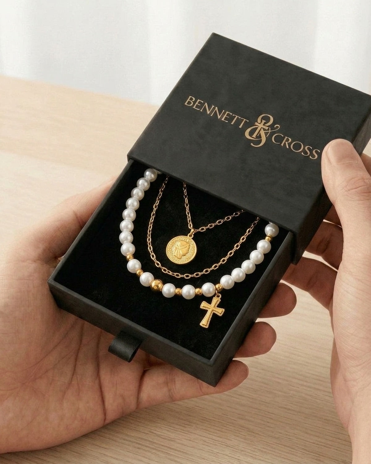 The Devout Layers in its black Bennett & Cross gift box