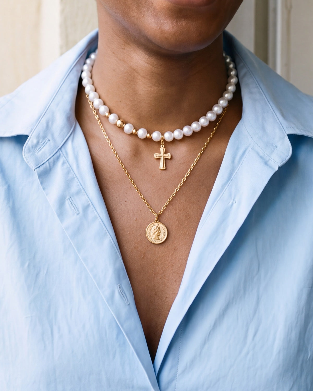 The gold Devout Layers worn by a woman, close-up, true to size