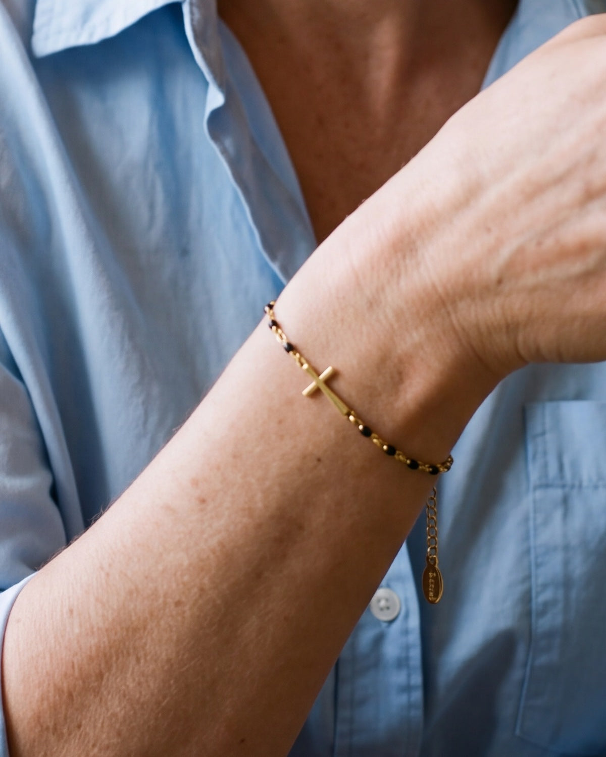 The Devout Path bracelet on the wrist, close-up, true to size [c:black]