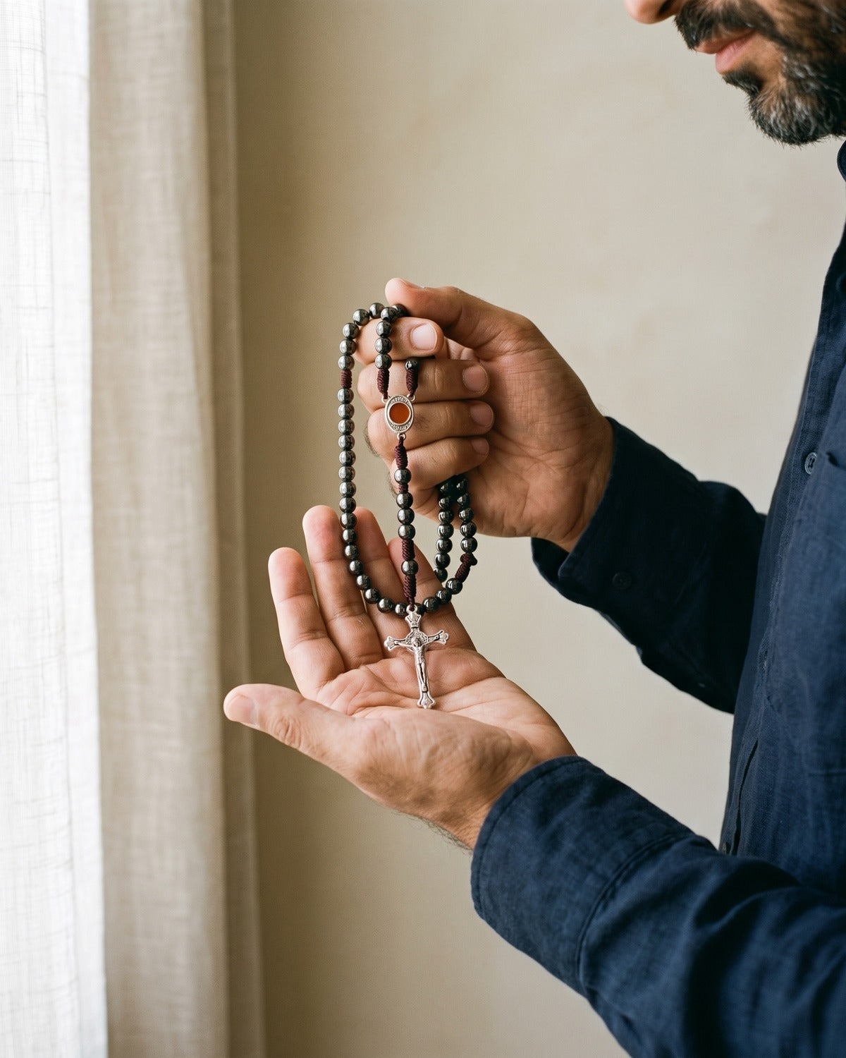 A man's hands holding the Devout Rosary rosary, true to size [c:hematite]