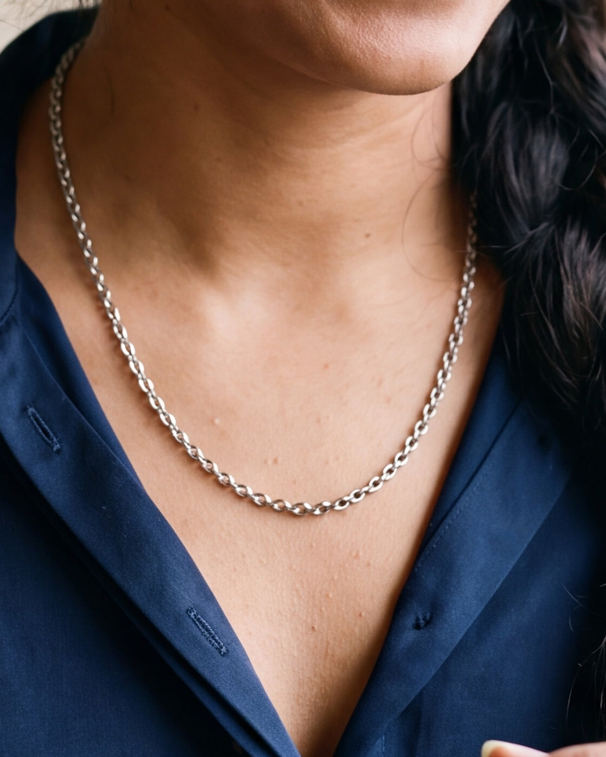 The Enduring Link worn on the chest, close-up, true to size
