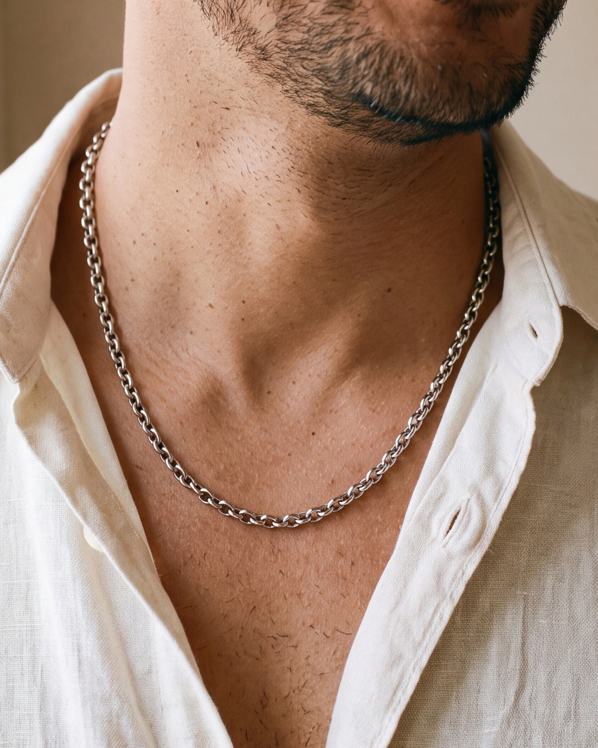 The Enduring Link worn by a man, close-up from chin to chest, true to size