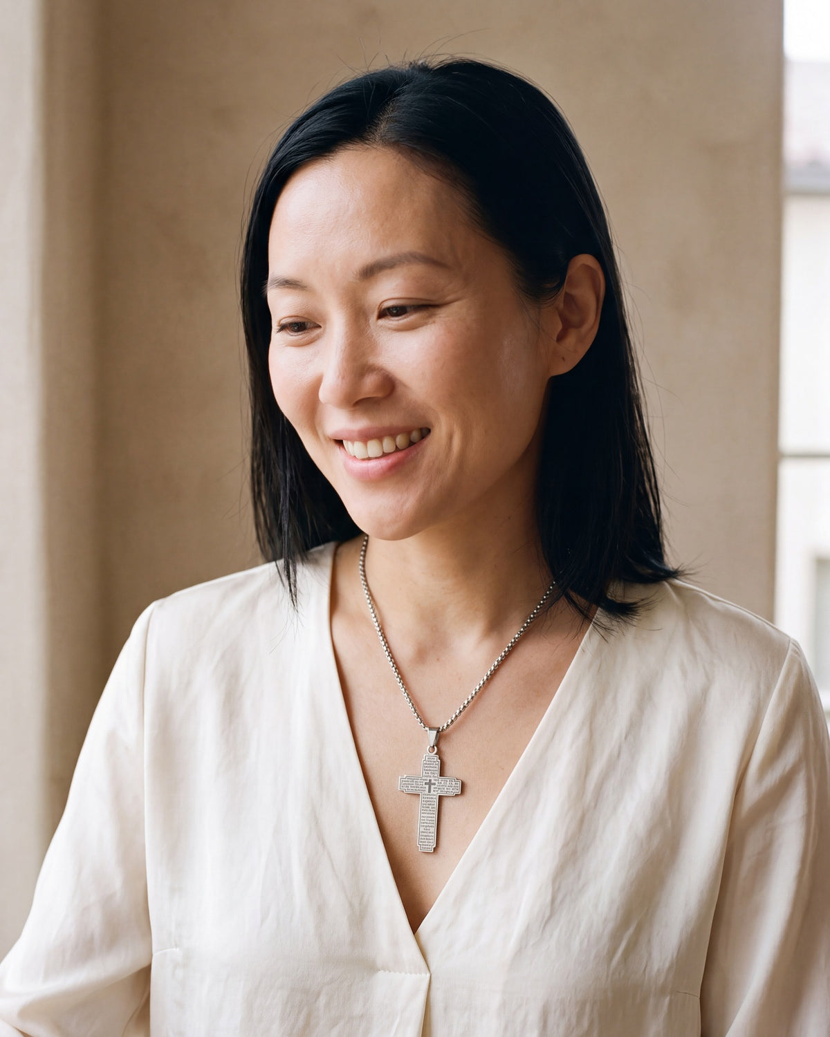 Smiling woman wearing The Engraved Prayer [c:silver]
