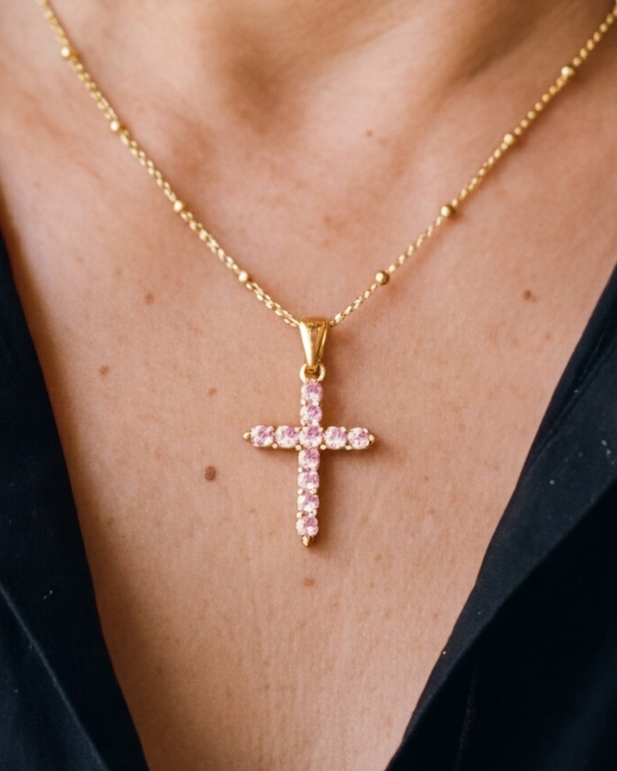 The gold / pink Gemmed Cross worn, close-up, true to size [c:gold-pink]