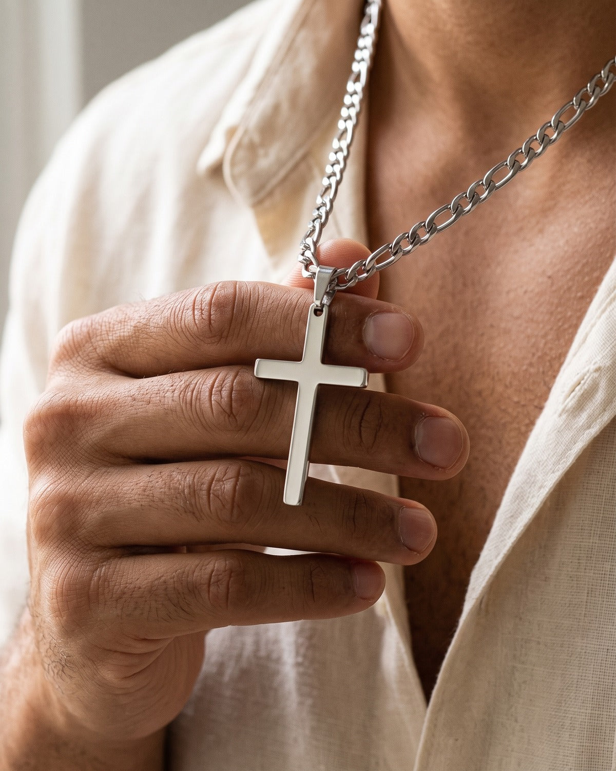 The Gilded Cross held in the hand, true to size [c:silver]