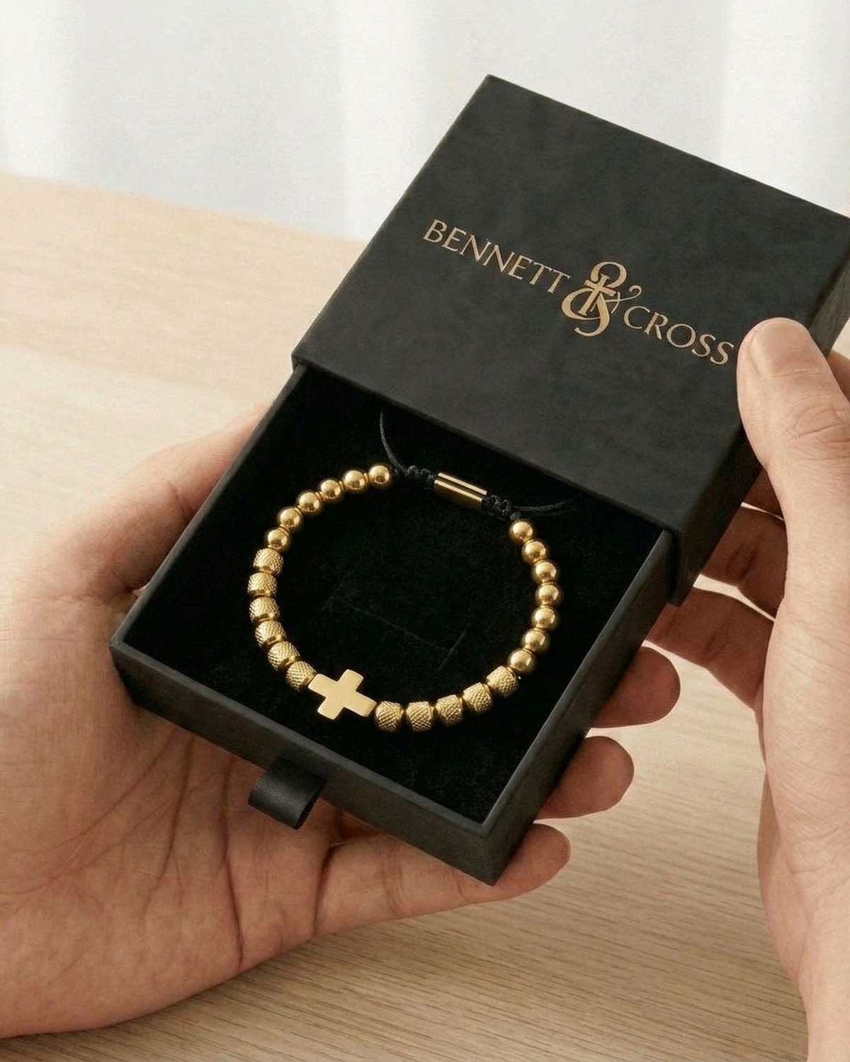 The gold Gilded Knot in its black Bennett & Cross gift box