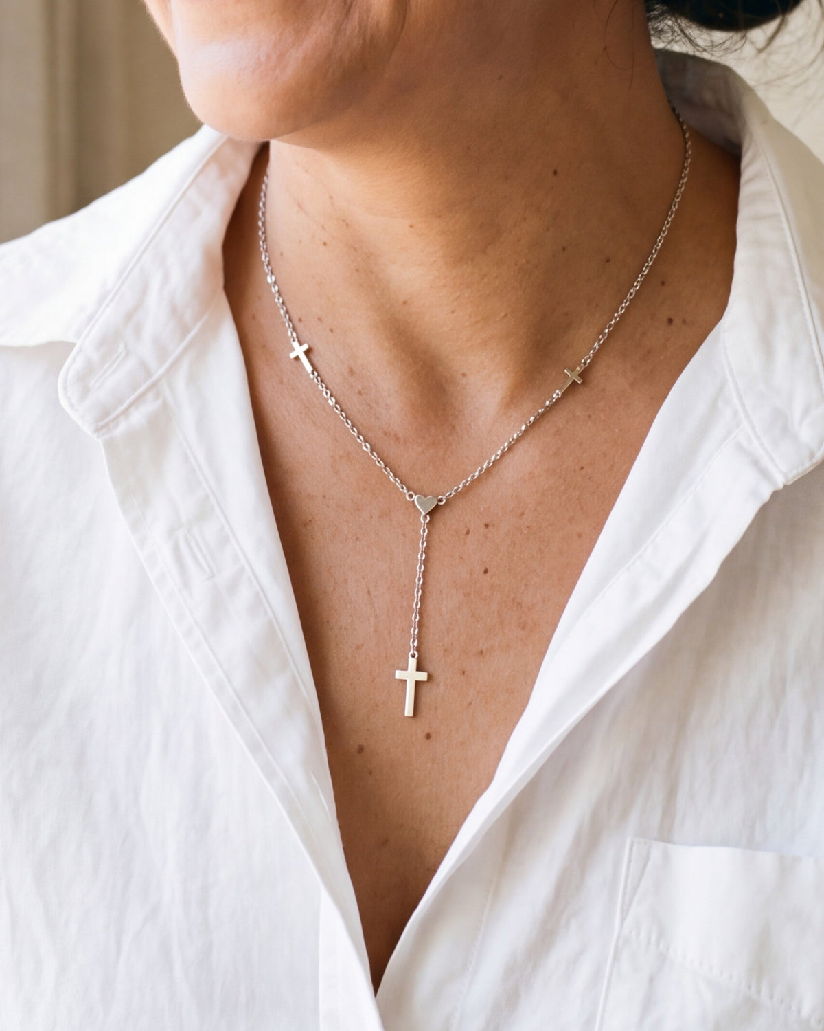 The Graceful Y worn on the chest, close-up, true to size [c:silver]