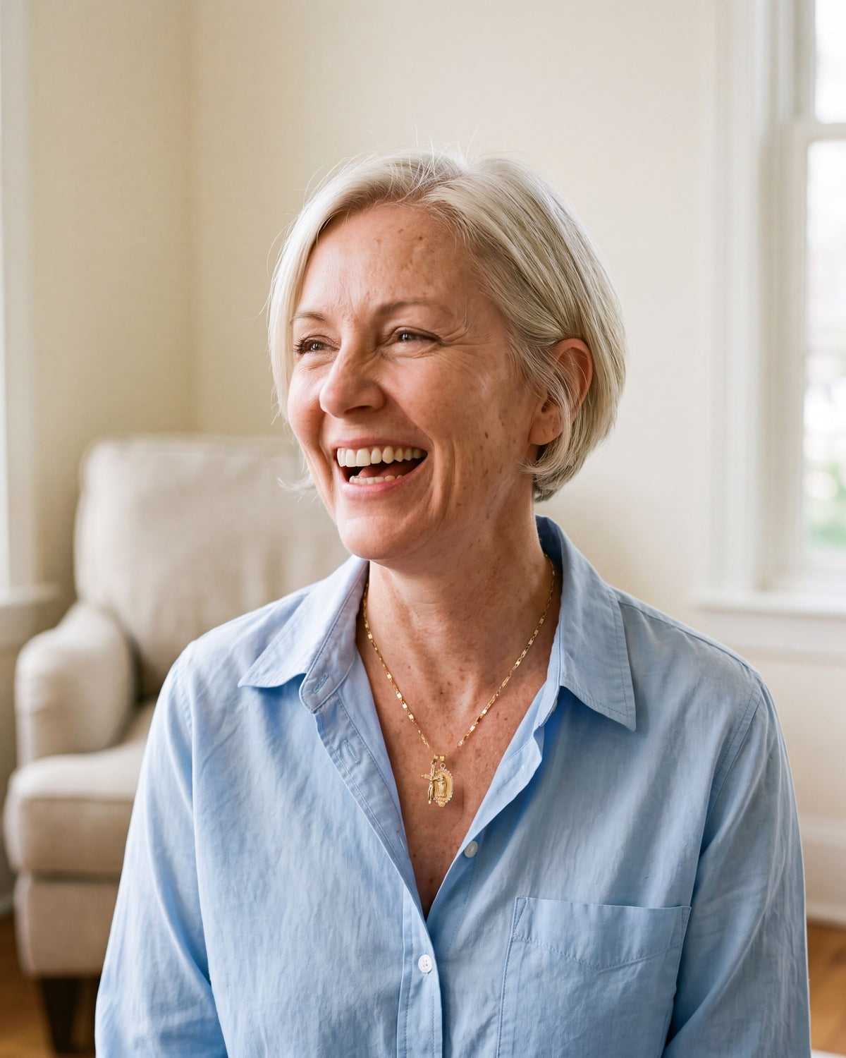Smiling woman wearing the gold Guadalupe Crucifix [c:gold]