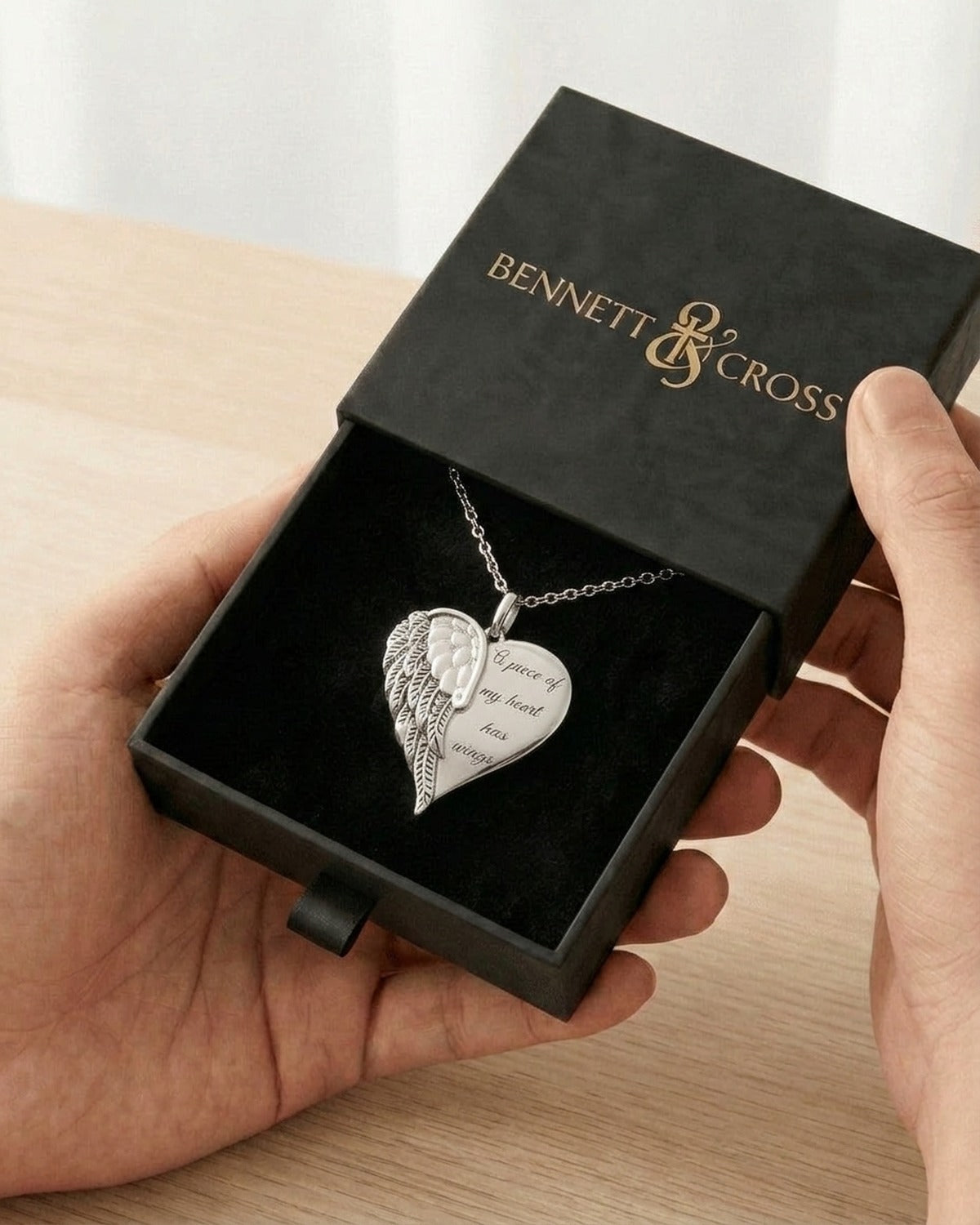 The Heart with Wings in its black Bennett & Cross gift box