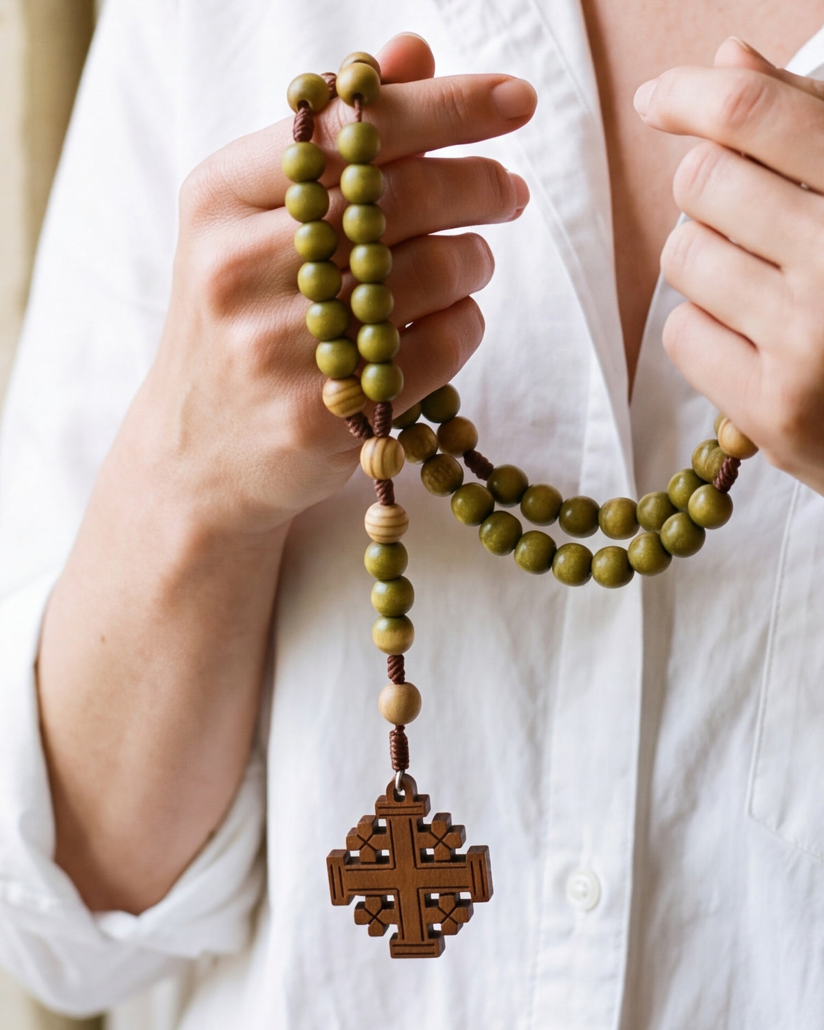 The Jerusalem Prayer rosary held in both hands, close-up