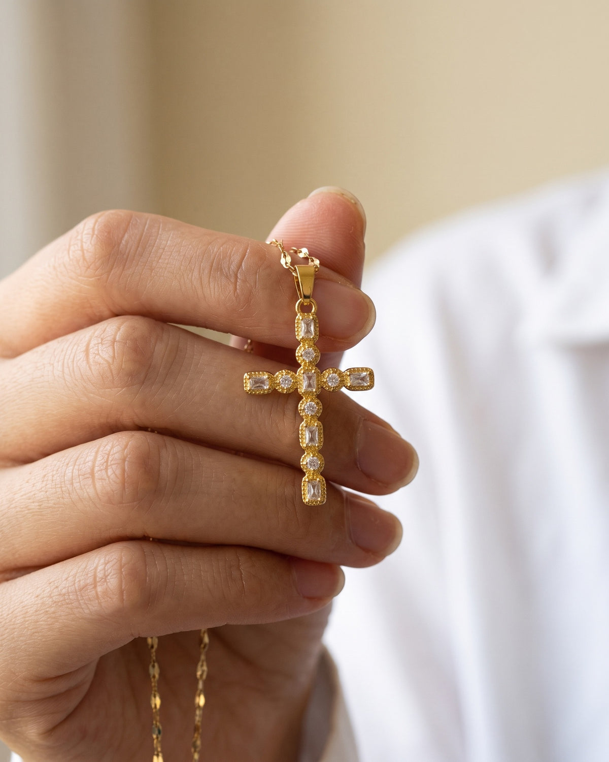 The Jeweled Cross held in the hand, true to size