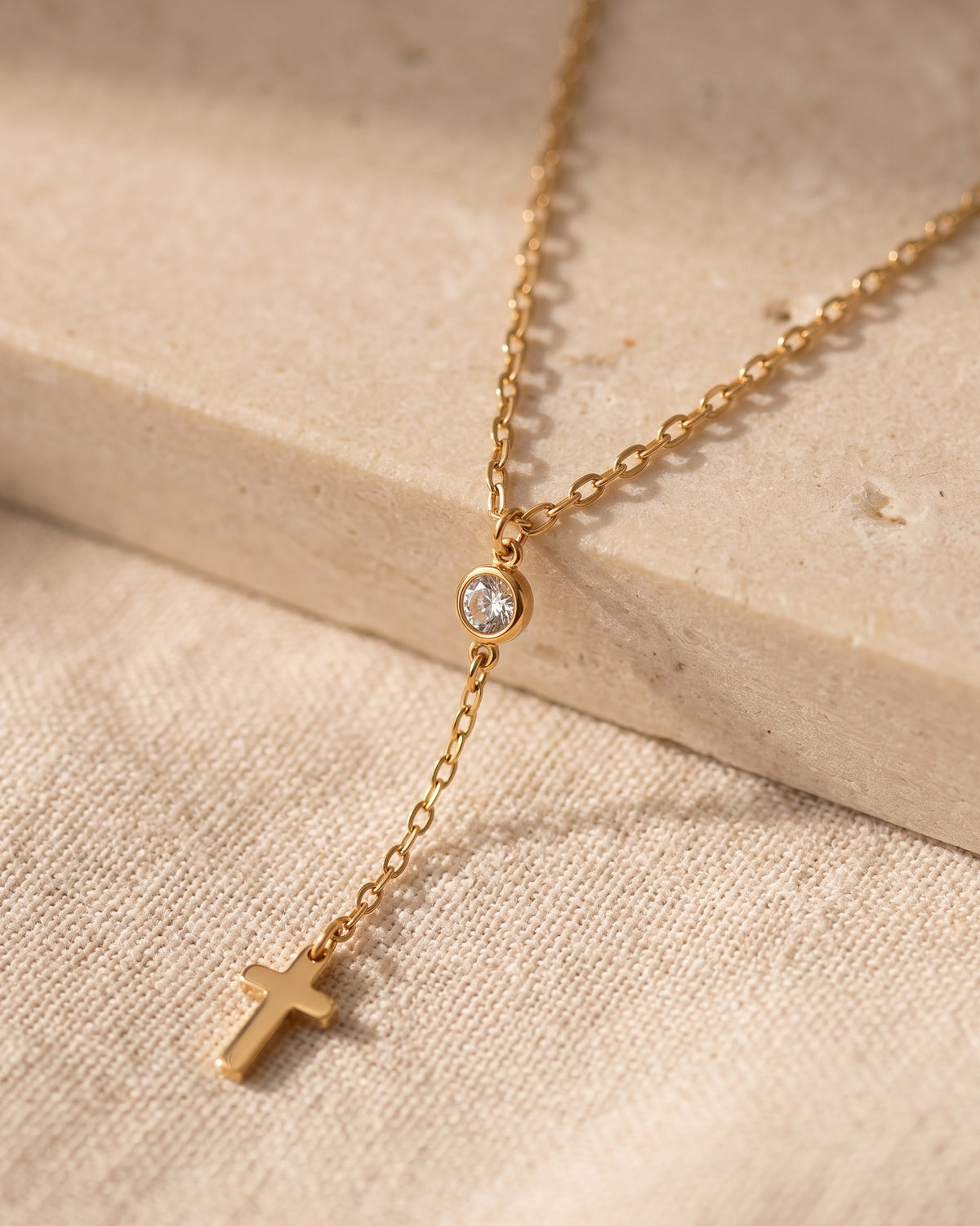 Close-up of The Lariat Cross, crystal connector and small cross