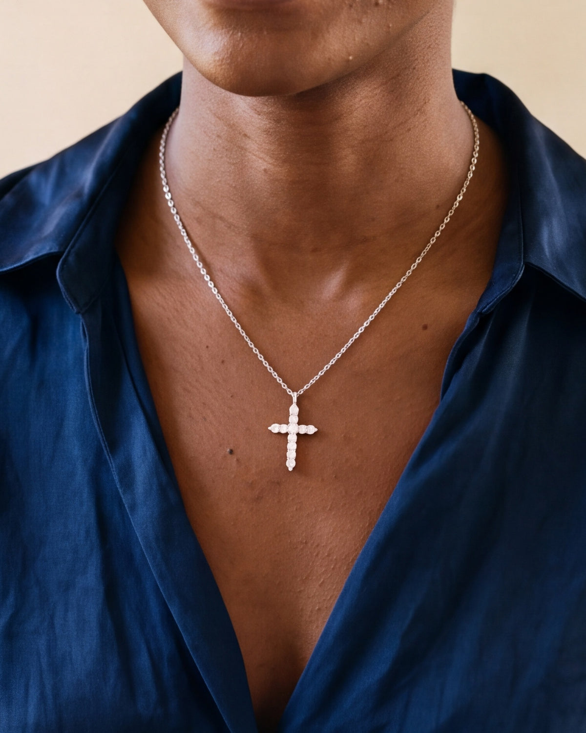 The silver Luminous Cross worn, second close-up, true to size [c:silver]