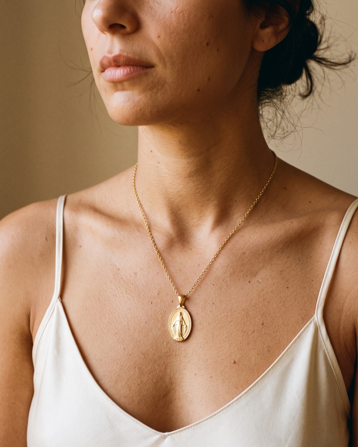 Close-up of the Miraculous Pendant as worn, true to size