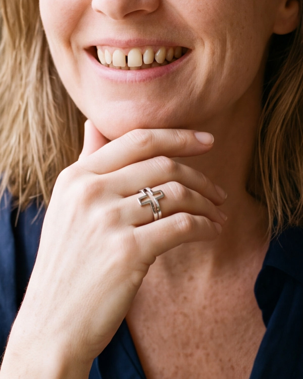 The silver Open Cross Ring worn by a woman, close-up on the hand, true to size [c:silver]