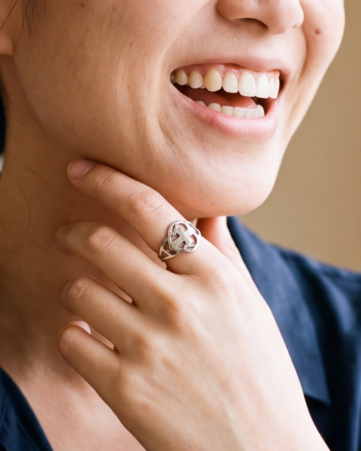 The silver Open Heart Cross worn by a woman, close-up, true to size [c:silver]