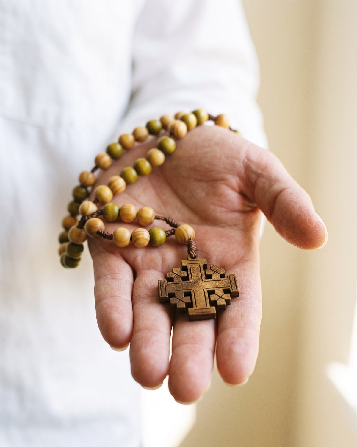 The Pilgrim's Rosary held in the hand, true to size