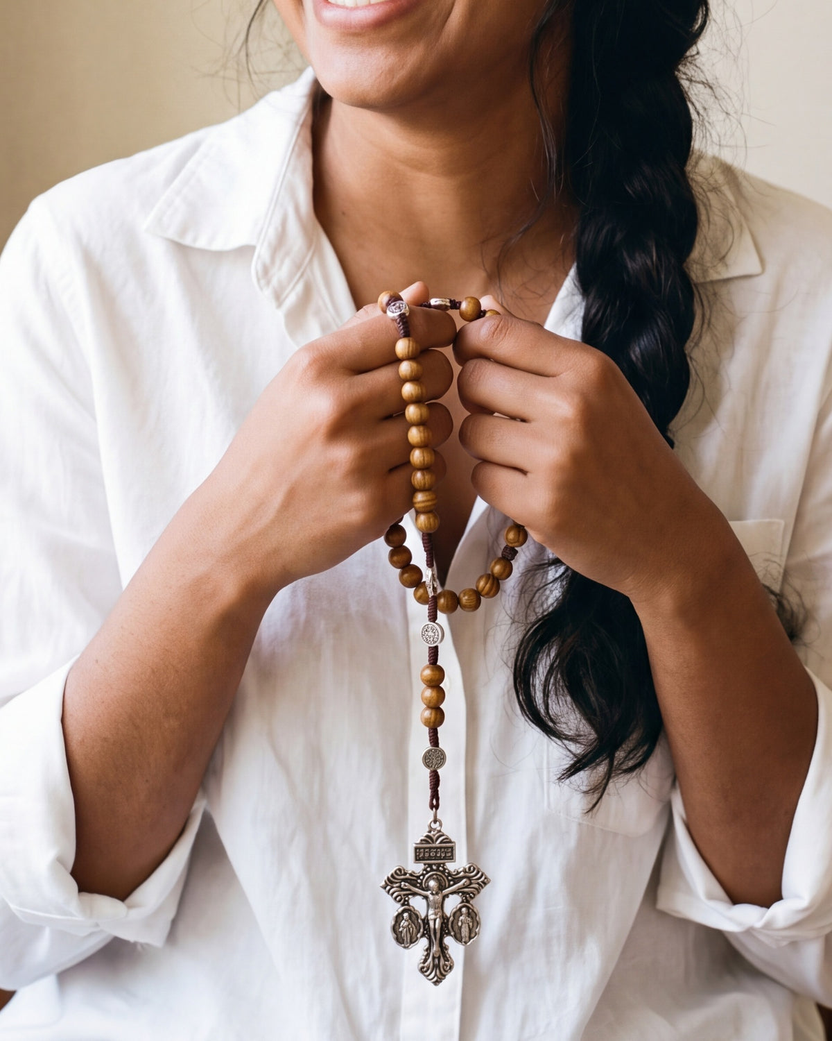 The Prayerful Rosary held in a woman's hands, close-up [c:pardon-crucifix]