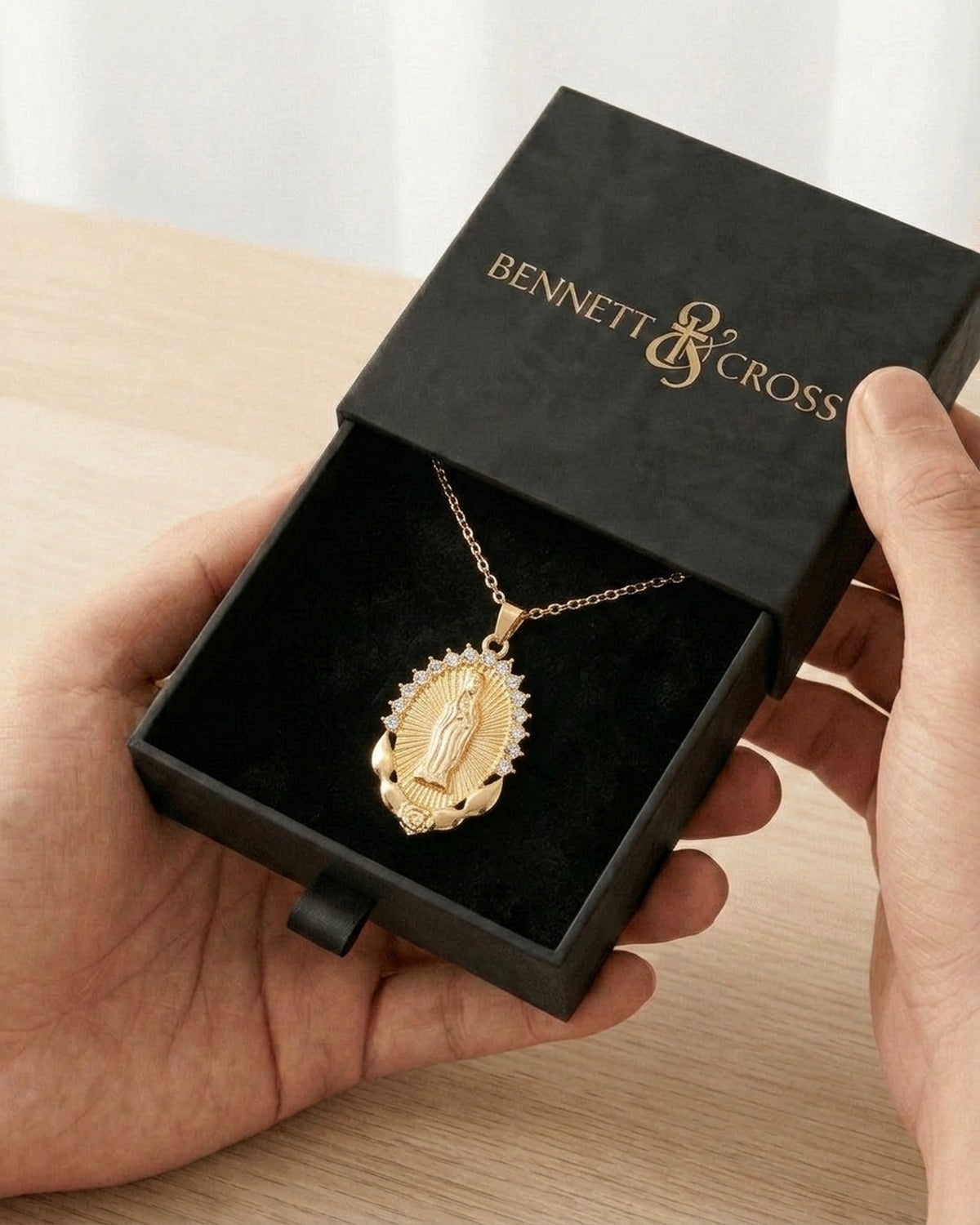 The Radiant Madonna in its black Bennett & Cross gift box